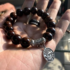 Chunky brown bracelet with charm